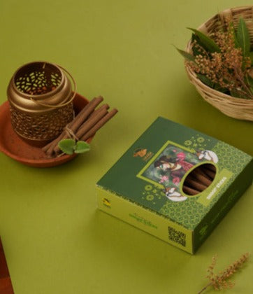 Tulsi dhoop sticks with gentle smoke, on a peaceful backdrop.